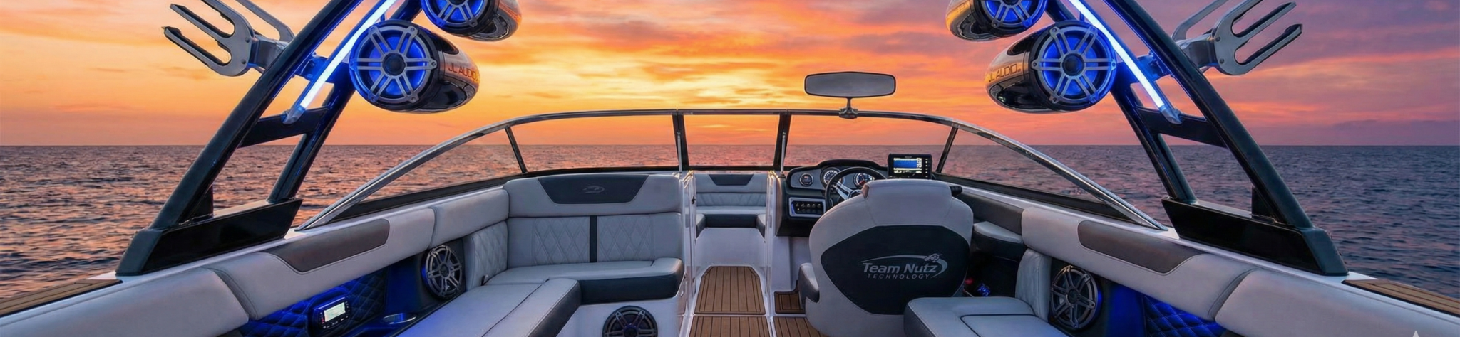 Custom marine audio system with speakers and blue accent lighting on a boat