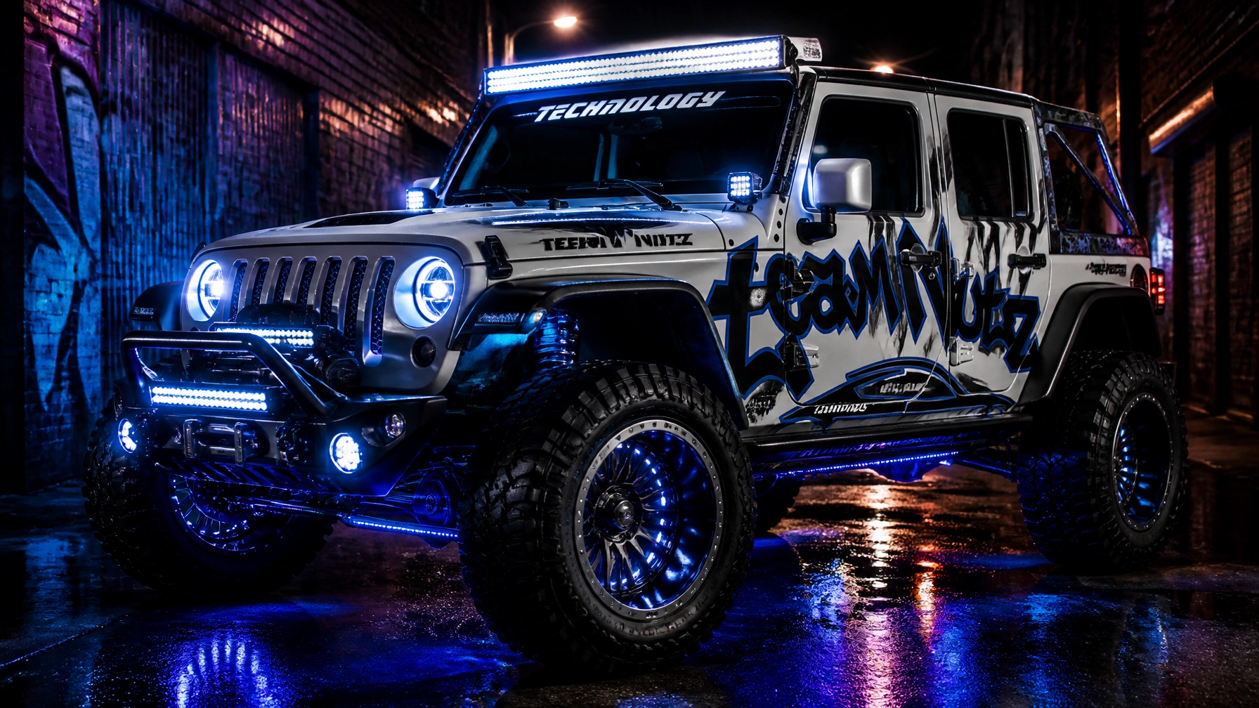 Customized white Jeep Wrangler in an alley at night with blue LED lights, neon graffiti wrap, and large off-road tires.