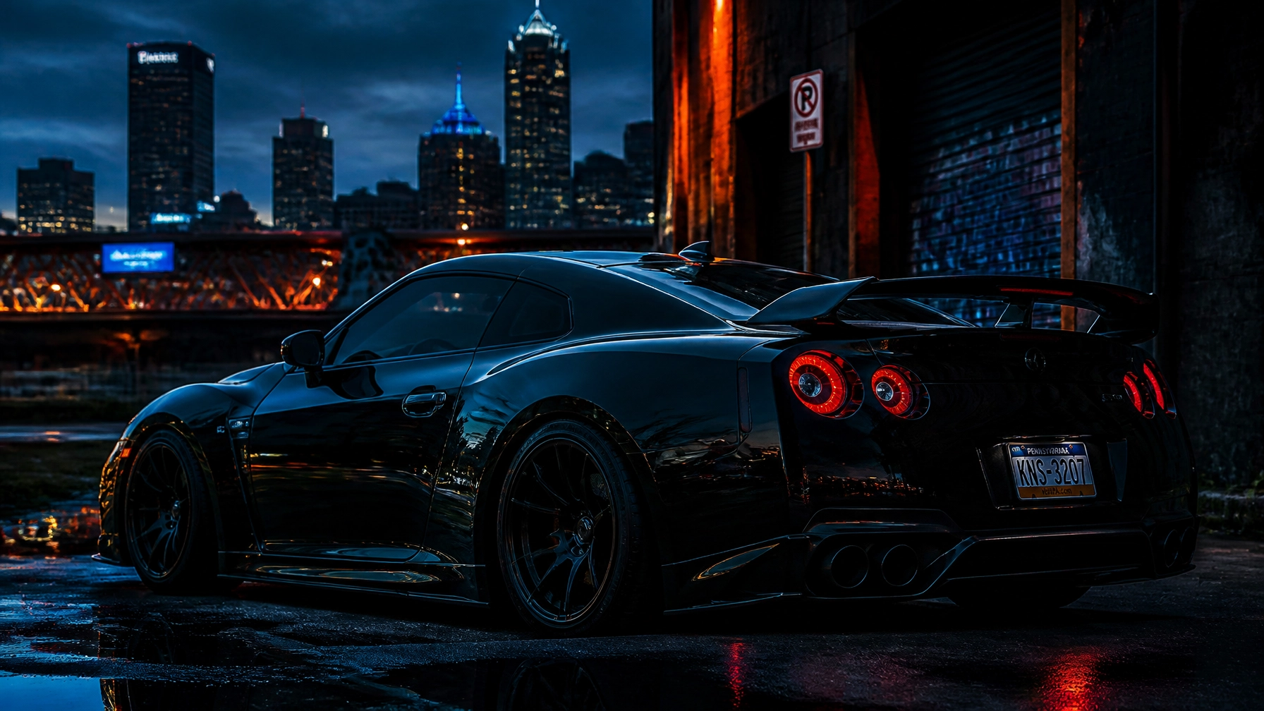 Rear three-quarter view of a black sports car with red taillights on a wet street at night, city skyline in the background.